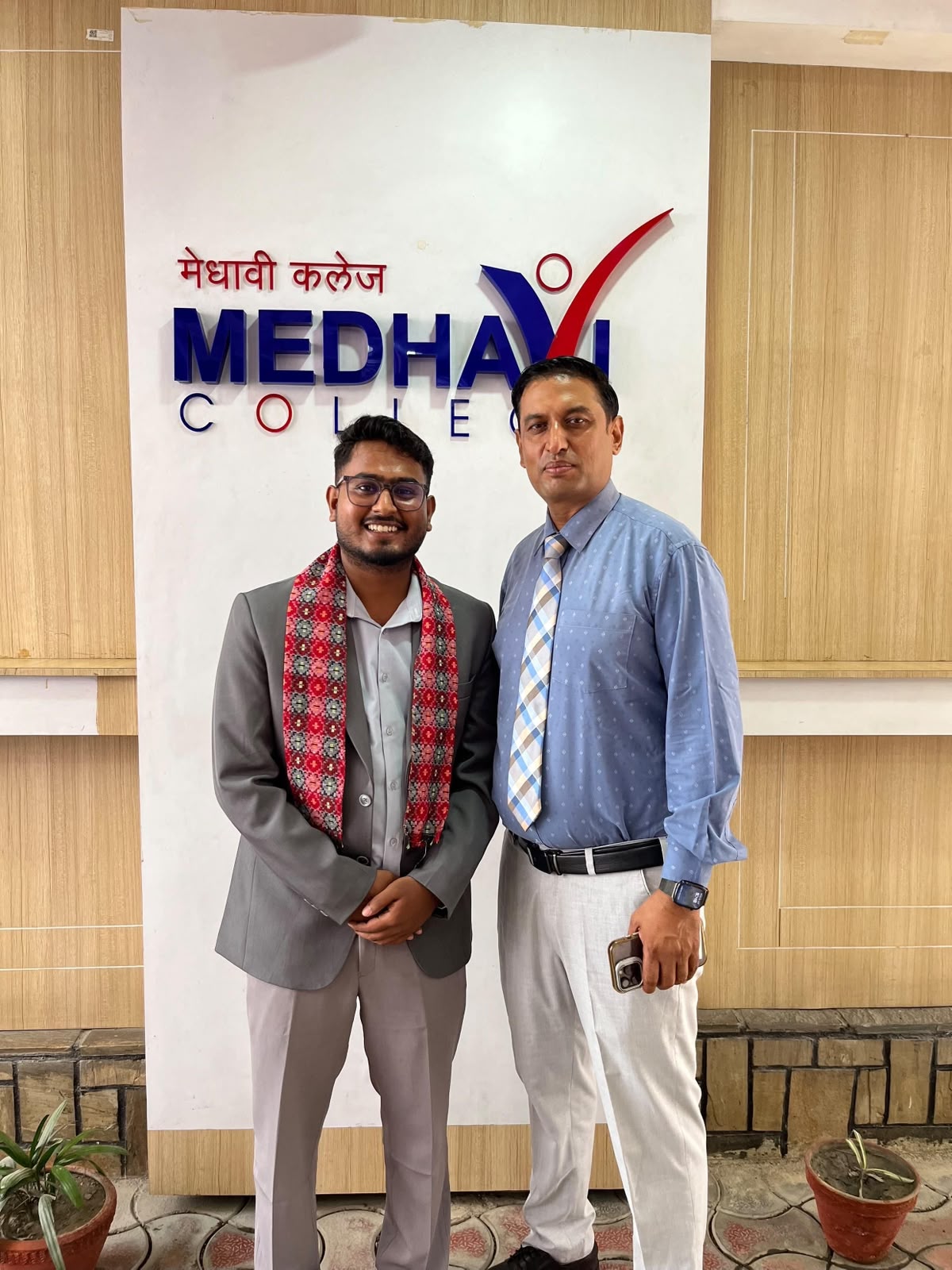 Kunal Sah with a Medhavi College representative after the induction session