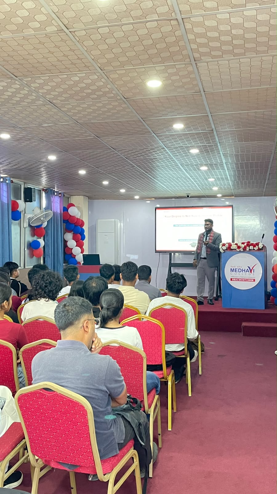 Kunal Sah speaking to students during the Medhavi College induction session
